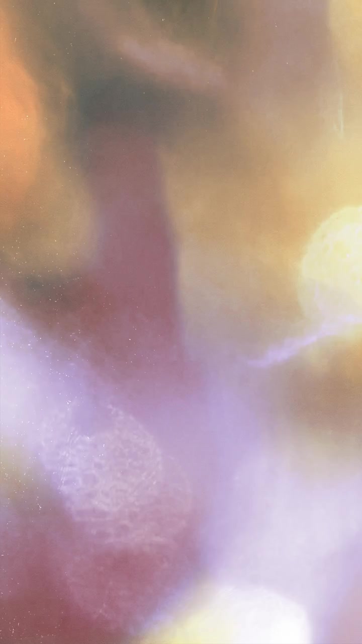Abstract Light Leaks and Bokeh Particles on Dark Background