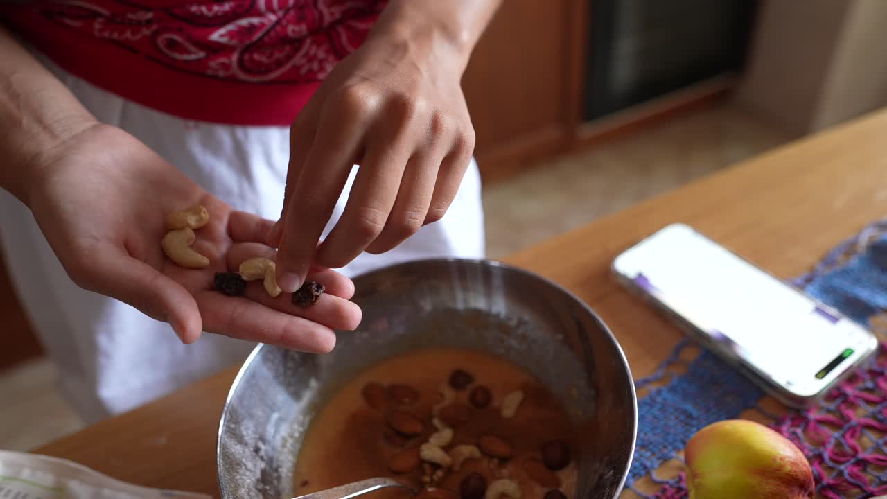 Preparing dessert with nuts and fruit
