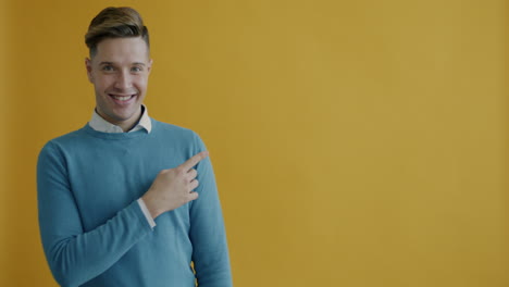 man pointing and smiling