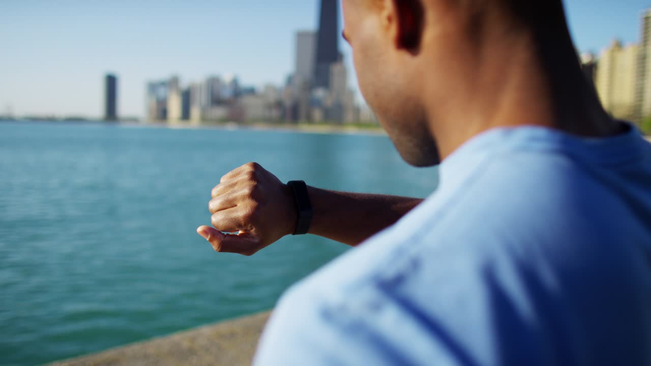 Close up Ethnic male smart watch sun flare