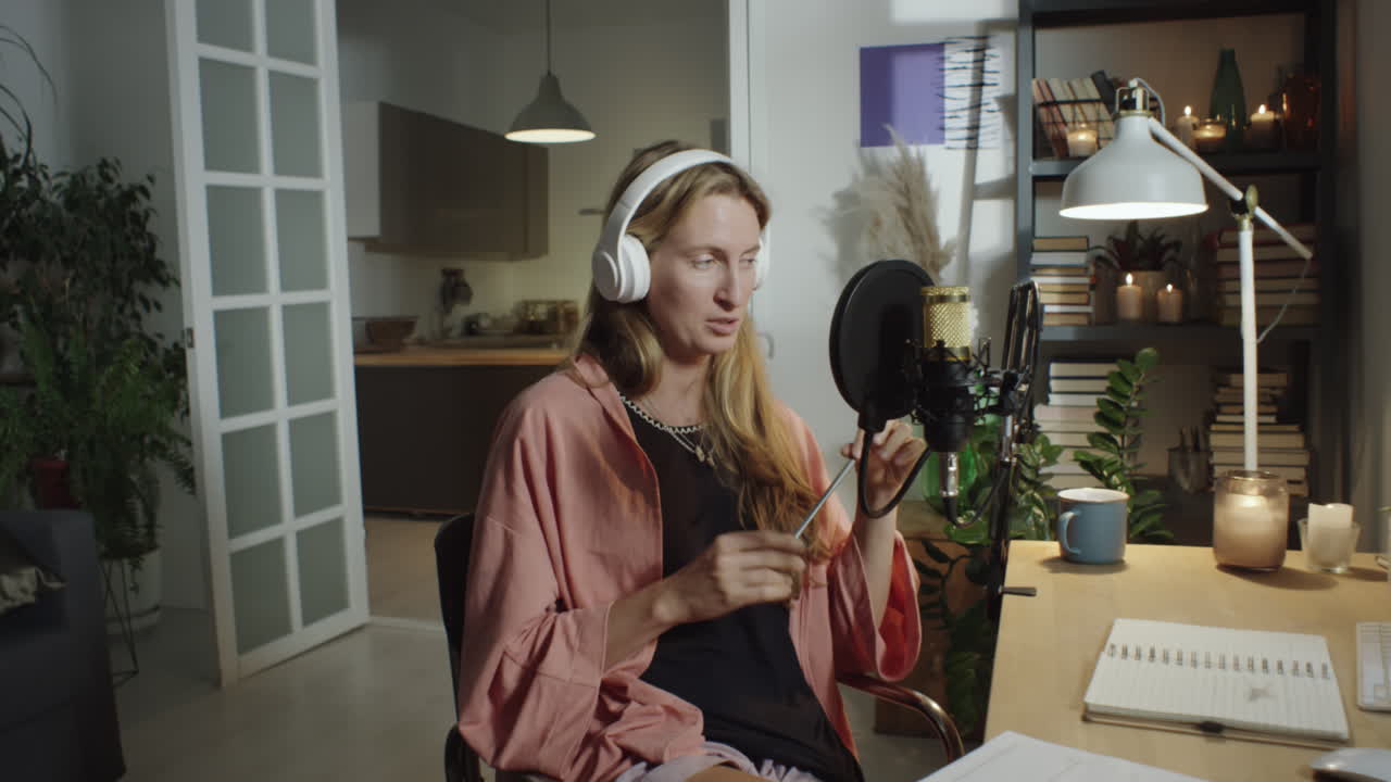 Woman Recording Podcast in Cozy Home Studio