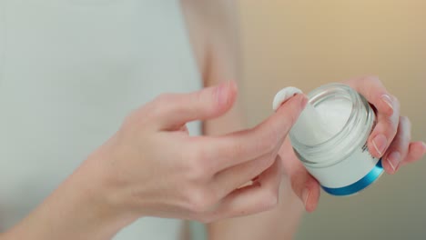 woman applying face cream