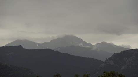 time lapse of storm clouds over mountains