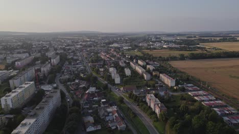 Flight-over-the-road-in-the-city-in-the-evening-of-summer-with-a-foggy-horizon