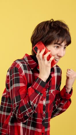 excited young woman celebrating on a phone call