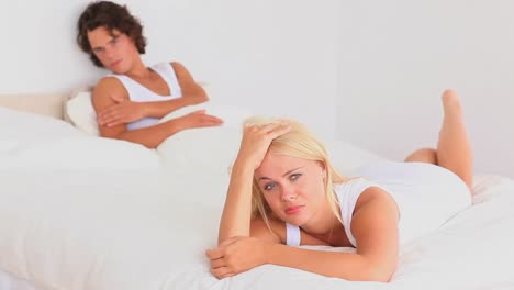 Unhappy-couple-on-a-bed