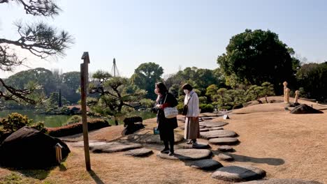 people walking and enjoying a peaceful garden