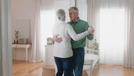 happy-mature-couple-dancing-at-home-enjoying-romantic-dance-together-celebrating-relationship-milestone-having-peaceful-retirement-4k