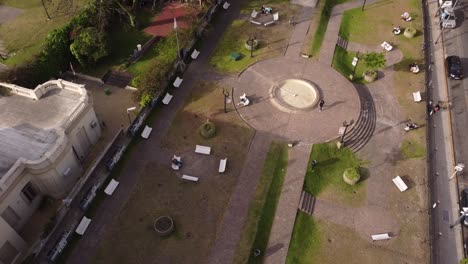 Aerial-top-down-shot-of-person-walking-inside-Park-during-sunny-day-in-Buenos-Aires---Doing-sport-on-fresh-air-for-health