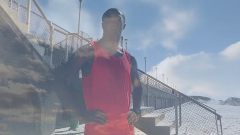 animation of clouds over an exercising african american man