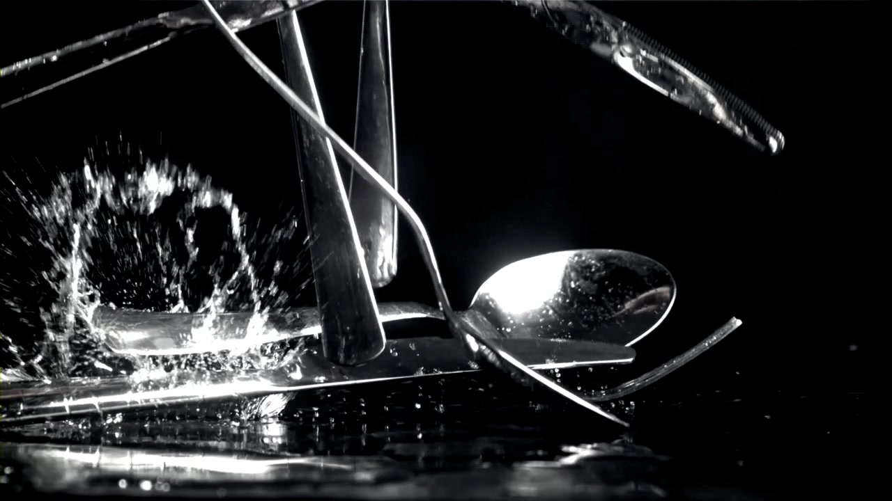 Cutlery Falling into Water with Splashes in Slow Motion