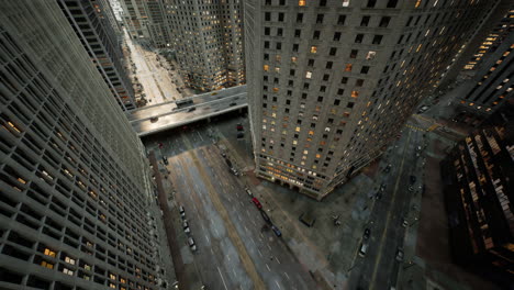 aerial hyperlapse of busy car traffic in between skyscrapers city center