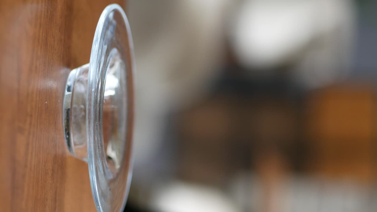 Coffee in a glass cup on a saucer