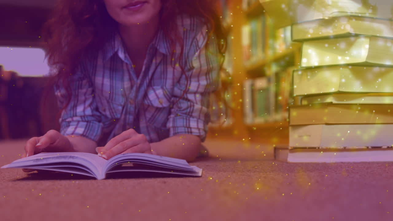 animación de manchas brillantes sobre una mujer caucásica leyendo un libro
