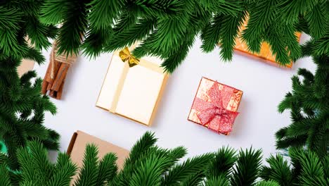 animation of christmas fir tree frame over presents on white background