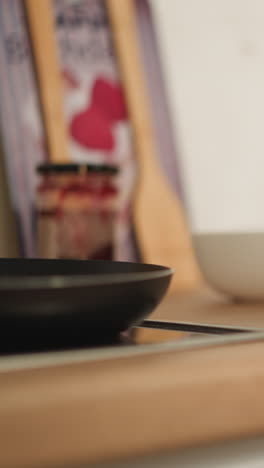 female hands take tasty pancakes from kitchen table. fresh home-cooked food. elderly woman worries about relatives preparing delicious dinner on free time closeup