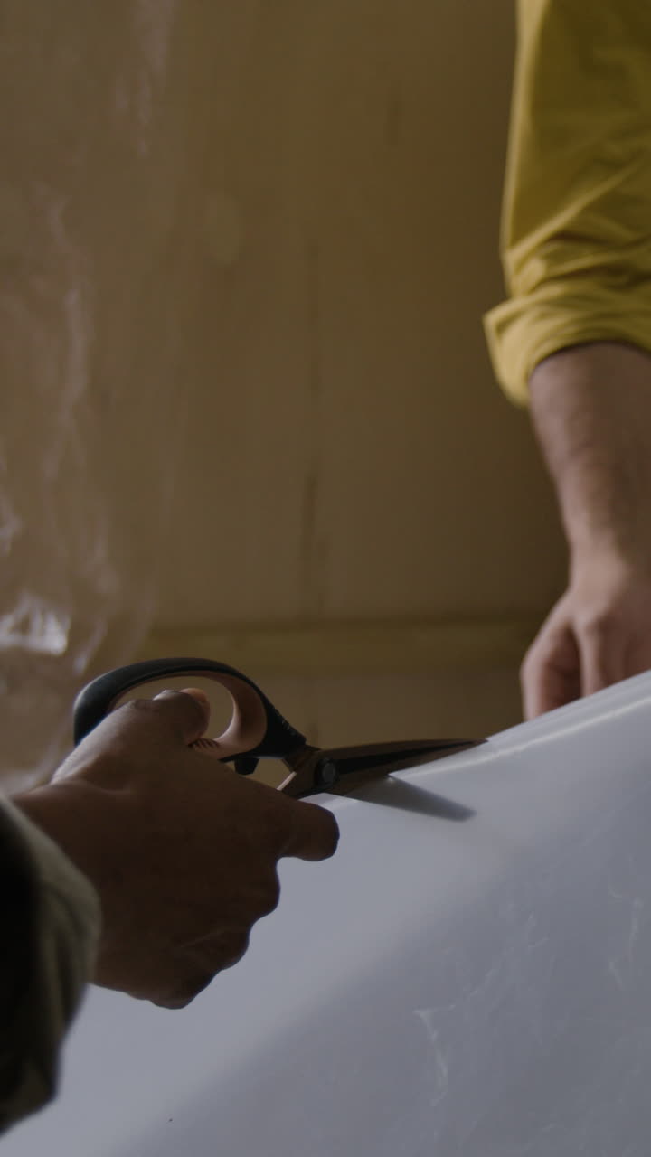 Cutting plastic with scissors