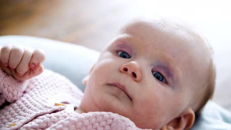 adorable baby lying on her mattress