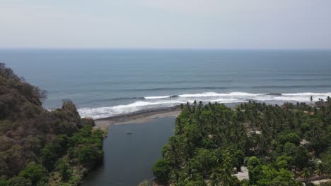 Aerial-view-rising-slowly-showing-a-beautiful-landscape-of-the-ocean-shore