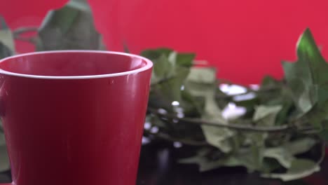 steam rising from a cup of coffee or tea with a bokeh effect and golden leaves