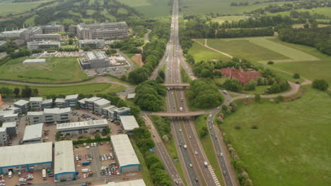 Establishing-aerial-shot-of-raised-road-interchange-over-A1-motorway-UK