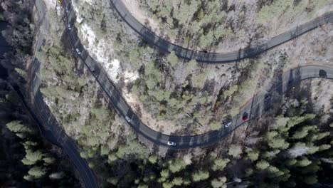 Switchback-road-with-cars-driving-on-Highway-89-A-in-Sedona,-Arizona-with-drone-overhead-stable