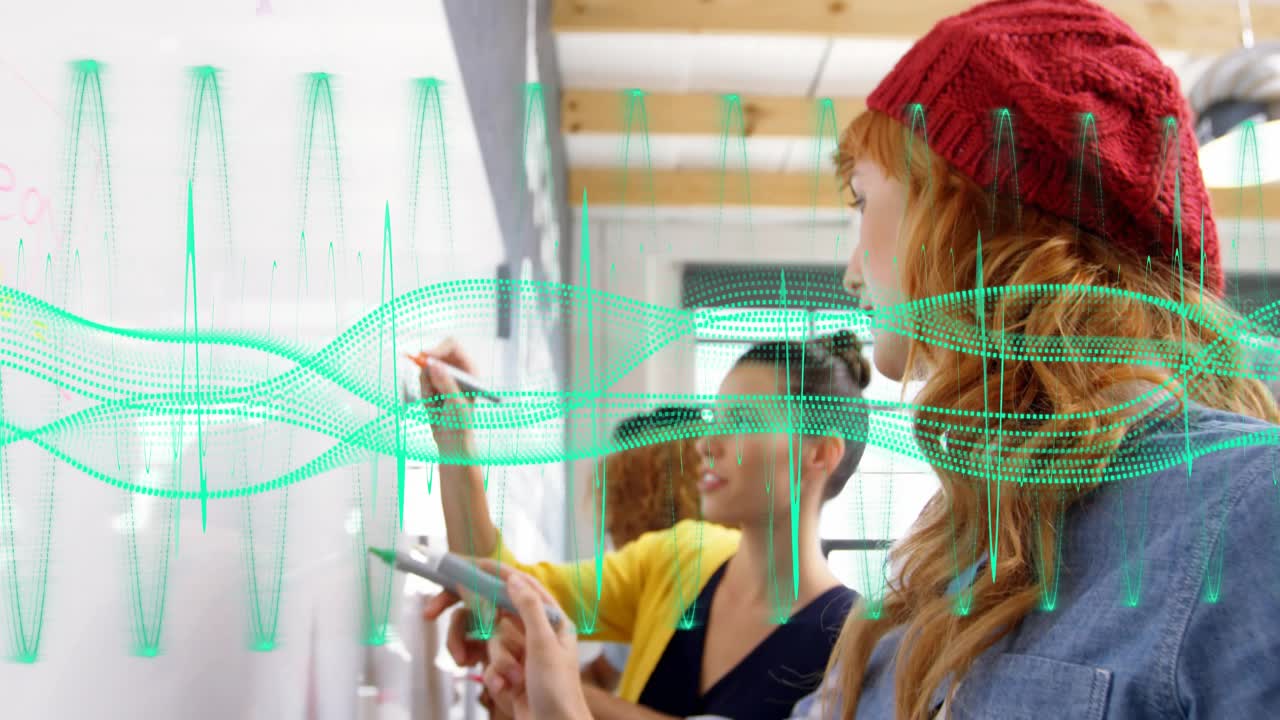 Right woman writing yellow highlighter on board cam panning team using tech, waveform over board