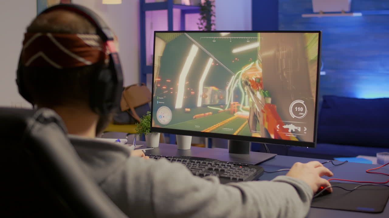 Professional player with headphones performing first person shooter video game