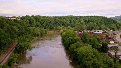 Drone flyover showing driftwood accumulation on the river’s edge after flooding in Asheville, NC