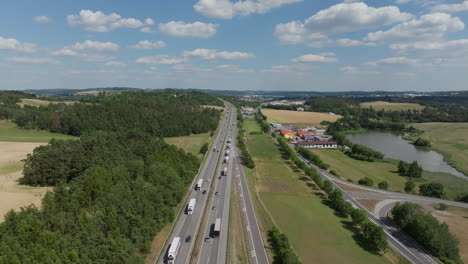 aerial view of a highway with traffic and surrounding landscape