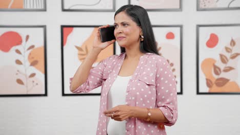 Happy-modern-Indian-woman-talking-on-phone