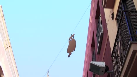 Party-decoration-hanging-in-the-street-between-buildings