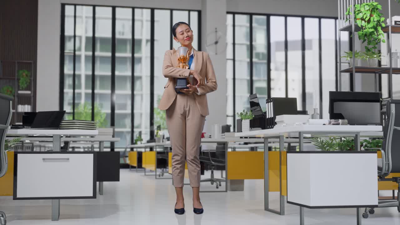 Businesswoman Celebrating Achievement in Modern Office