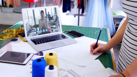 Female-designer-having-a-video-conference-