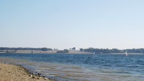 Windsurfers Practicing on a Lake