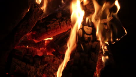 closeup of a fireplace. logs burning 4k