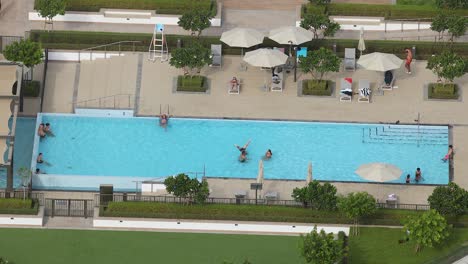 people enjoying a poolside day in dubai