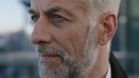 close up portrait of mature businessman turning head looking leadership accomplishment