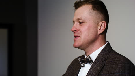 Man in elegant suit with gavel