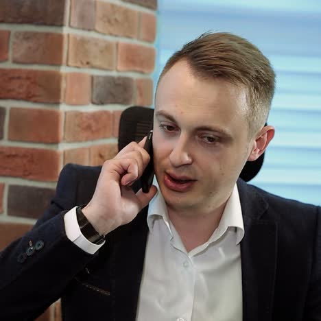 Business Man Is Doing A Deal Over The Phone
