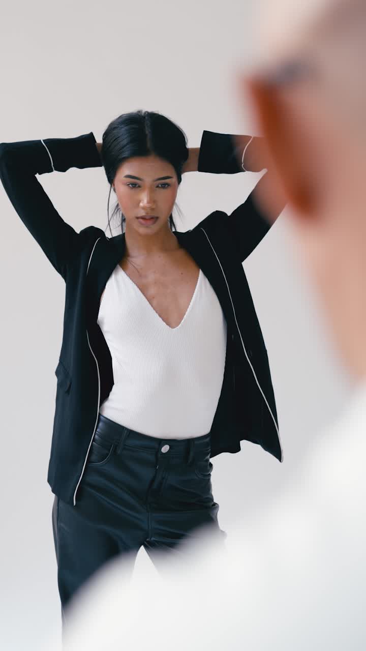 Fashionable woman in blazer and leather pants