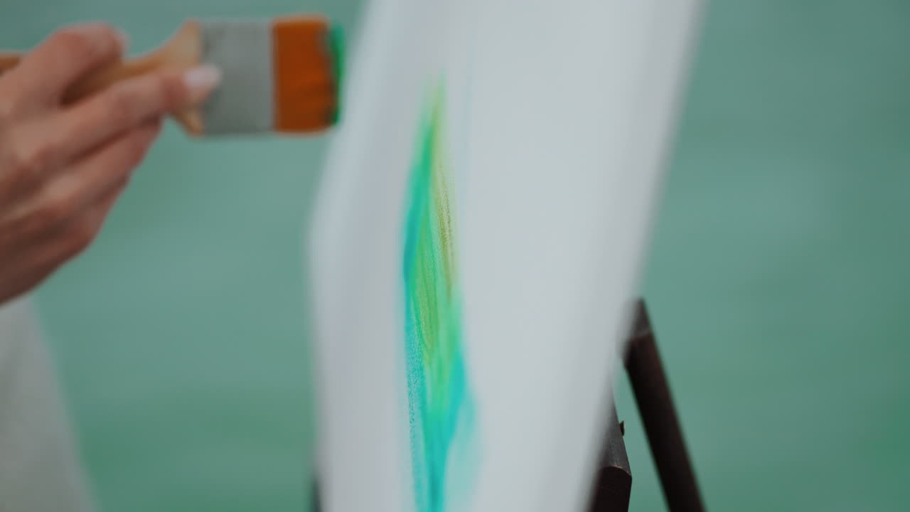 Artist painting a canvas