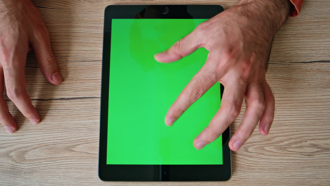 Designer zooming green screen tablet creating project at home office closeup