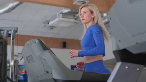 woman working out on a treadmill at the gym