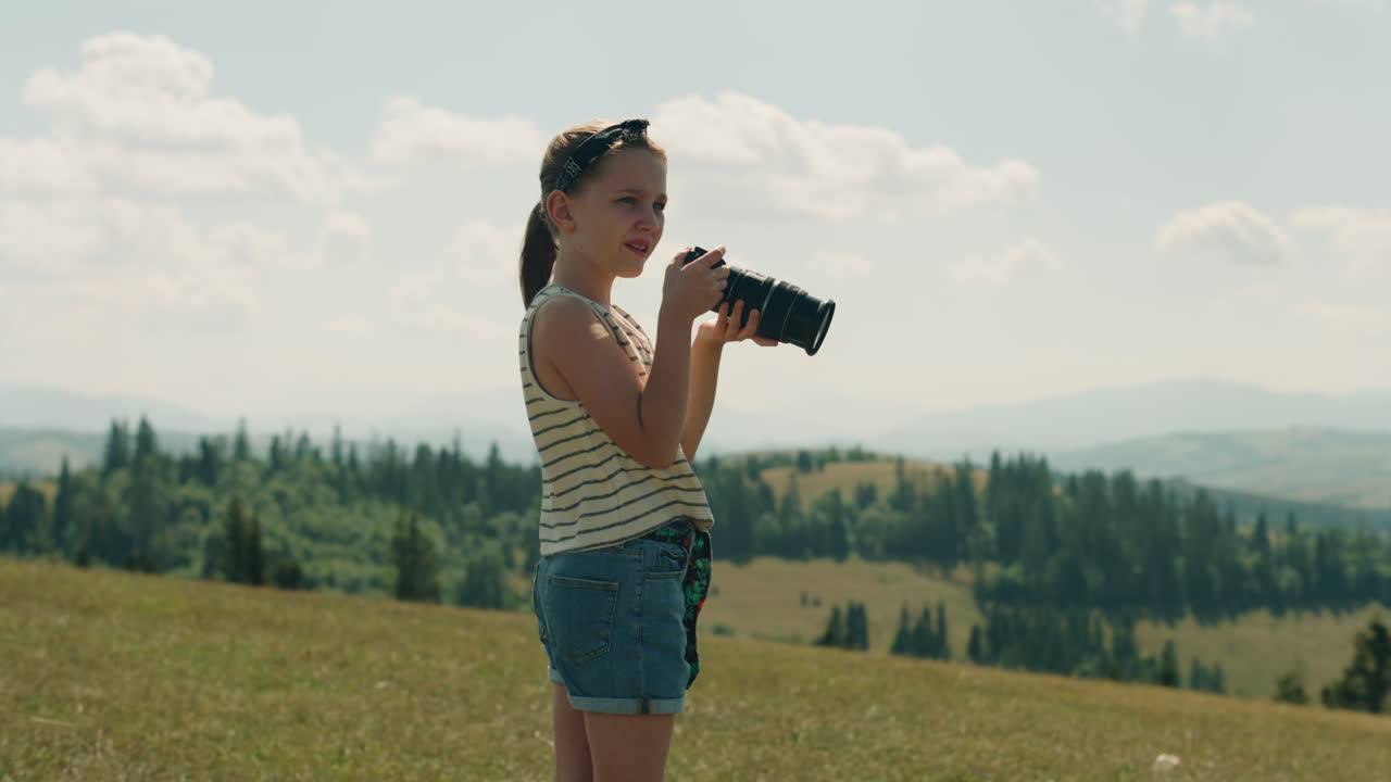 Young Girl Photographer Shooting Landscape Young Photographer Shooting Landscape on Beautifull Green Hillway Taking Pictures of Nature Girl Filling the Portfolio with Amazing Photos Spending Leisure Time Outdoor Slow Motion