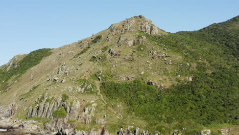 Morro-Da-Coroa-establishing-aerial-cinematic-shot-at-Lagoinha-Do-Leste-beach,-Florianopolis,-Santa-Catarina,-Brazil