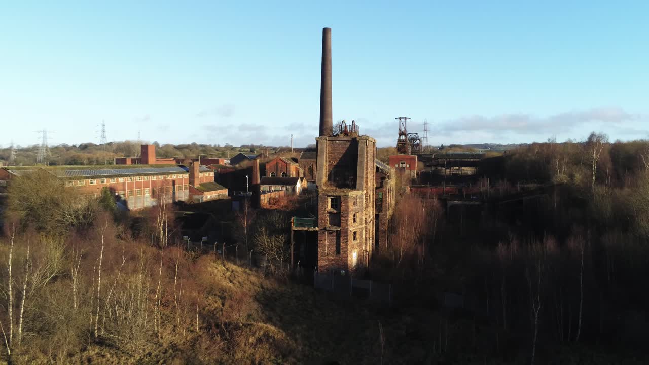 Abandoned run down Staffordshire historical industrial coal mine buildings aerial view