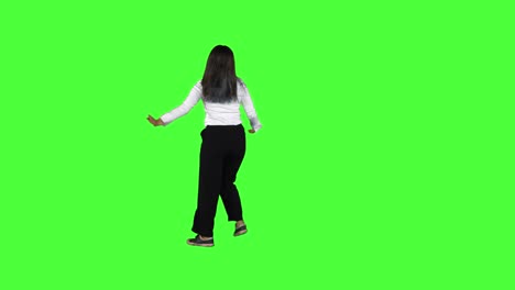 rear view of happy businesswoman dancing