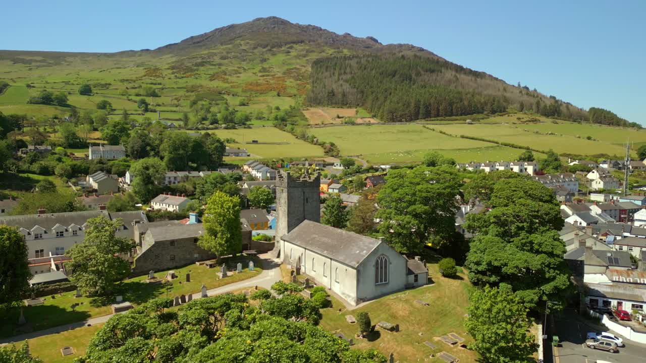 Tight reversing aerial video of The Church of the Holy Trinity in Carlingford, County Louth, Ireland on a bright and sunny day. Filmed in 4K, 60FPS and with Rec709 color.