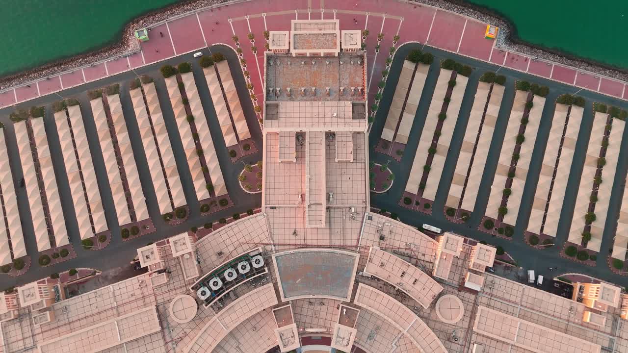 Stunning 4K aerial top-down footage of a coastal structure in Kuwait. Captures geometric architecture, sea contrast, and symmetry—ideal for architecture, real estate, or travel visuals.